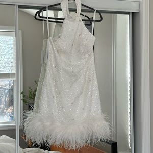 White sequined halter dress, feathered bottom. From Untamed Petals. Size 10 NWT